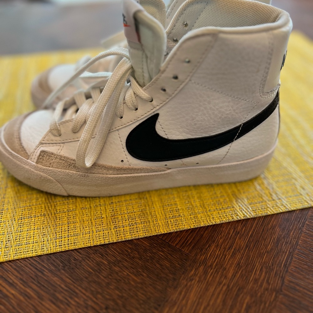 Nike white leather high tops.